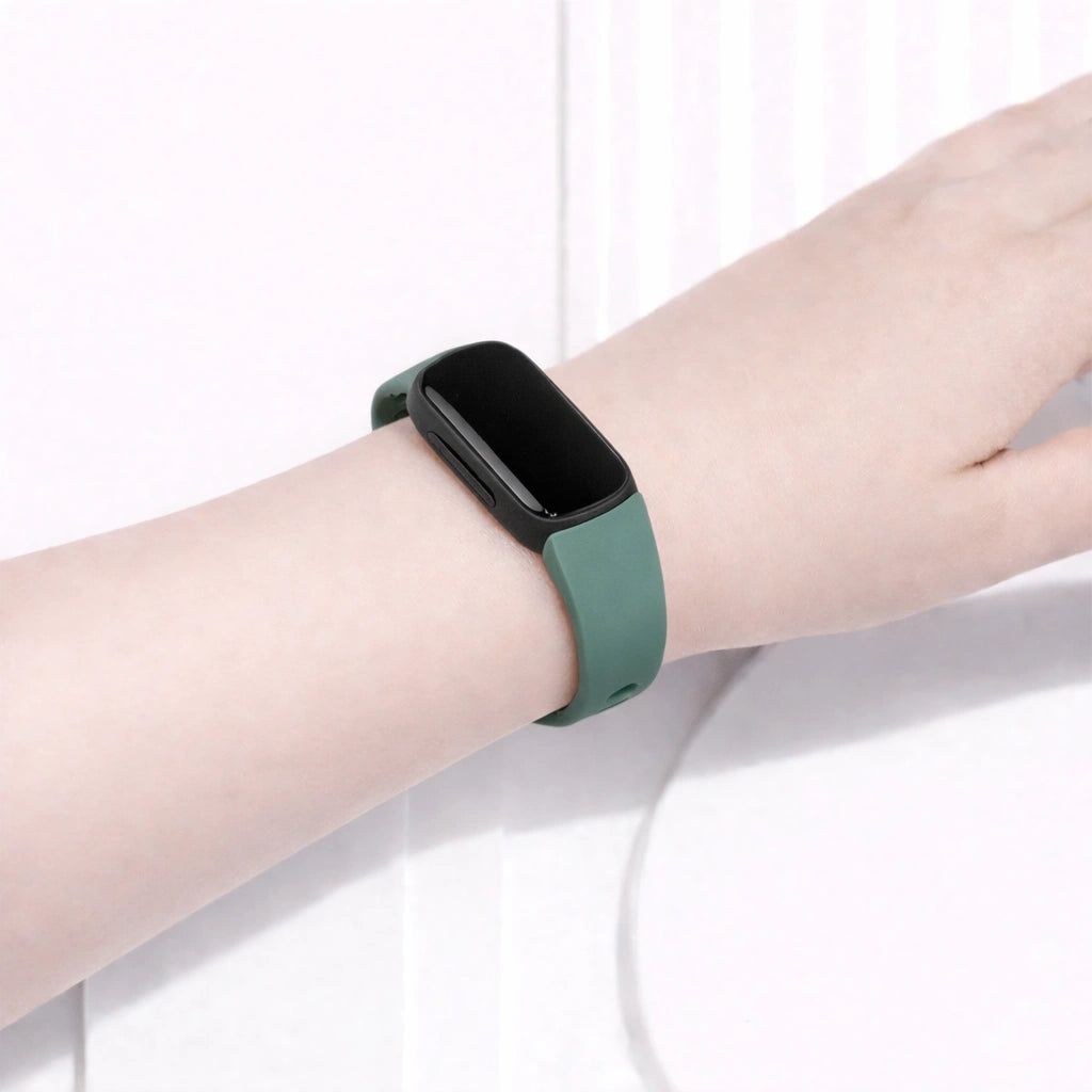 Green watch strap fitted to a Fitbit Inspire 3 during everyday wear