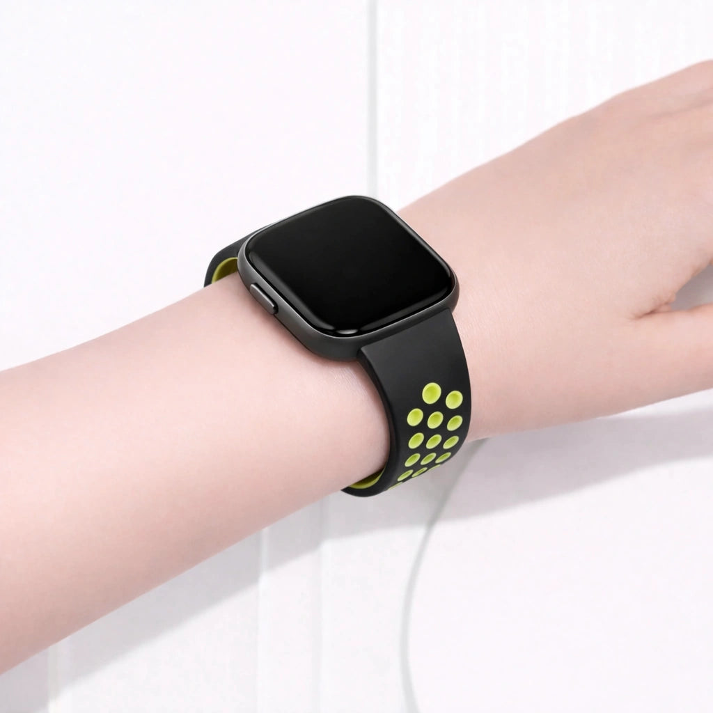 Fitbit Versa 2 sports band in black and green worn on the wrist for workouts and everyday wear