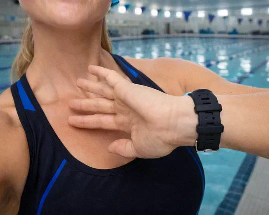 Black Fitbit band worn during an indoor swimming workout