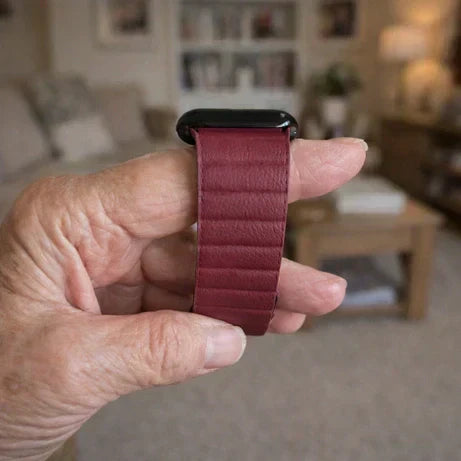 Easy-to-use Apple Watch strap held in elderly hands inside a living room