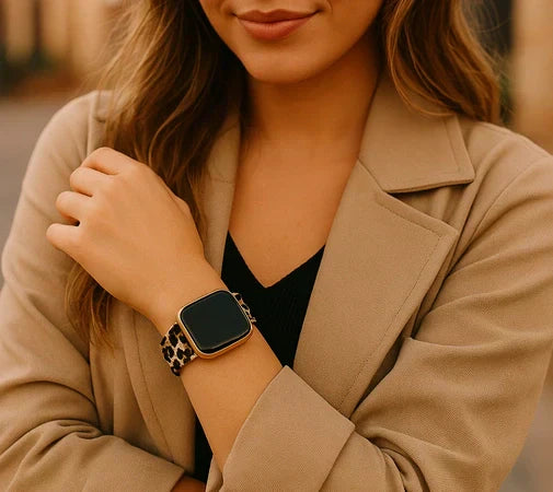 Woman wearing a stylish leopard print Apple Watch band with a neutral fashion outfit