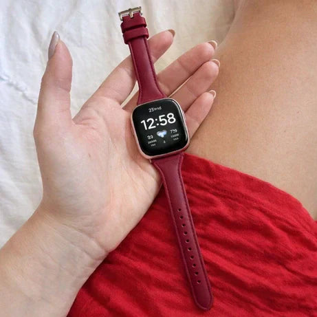 Close-up of a wine red Fitbit Versa 4 band designed for sensitive skin and all-day comfort.