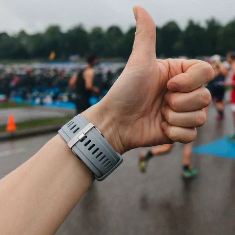 Garmin watch worn with a secure grey strap during a triathlon race event