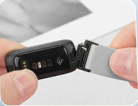 How to change the strap on a Fitbit Inspire 3 by pressing the pins into the watch lug