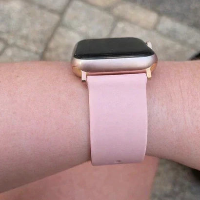 Blush pink strap paired with a rose gold Apple Watch for a soft, neutral colour match
