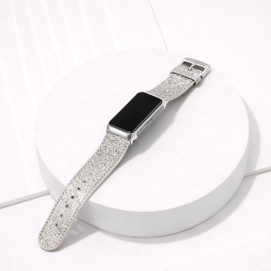 Silver shimmer leather strap for Fitbit Charge 6 displayed flat on a white surface
