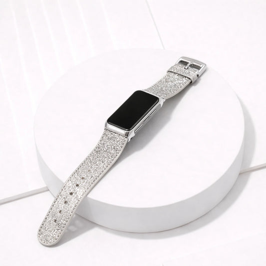 Silver shimmer leather strap for Fitbit Charge 6 displayed flat on a white surface