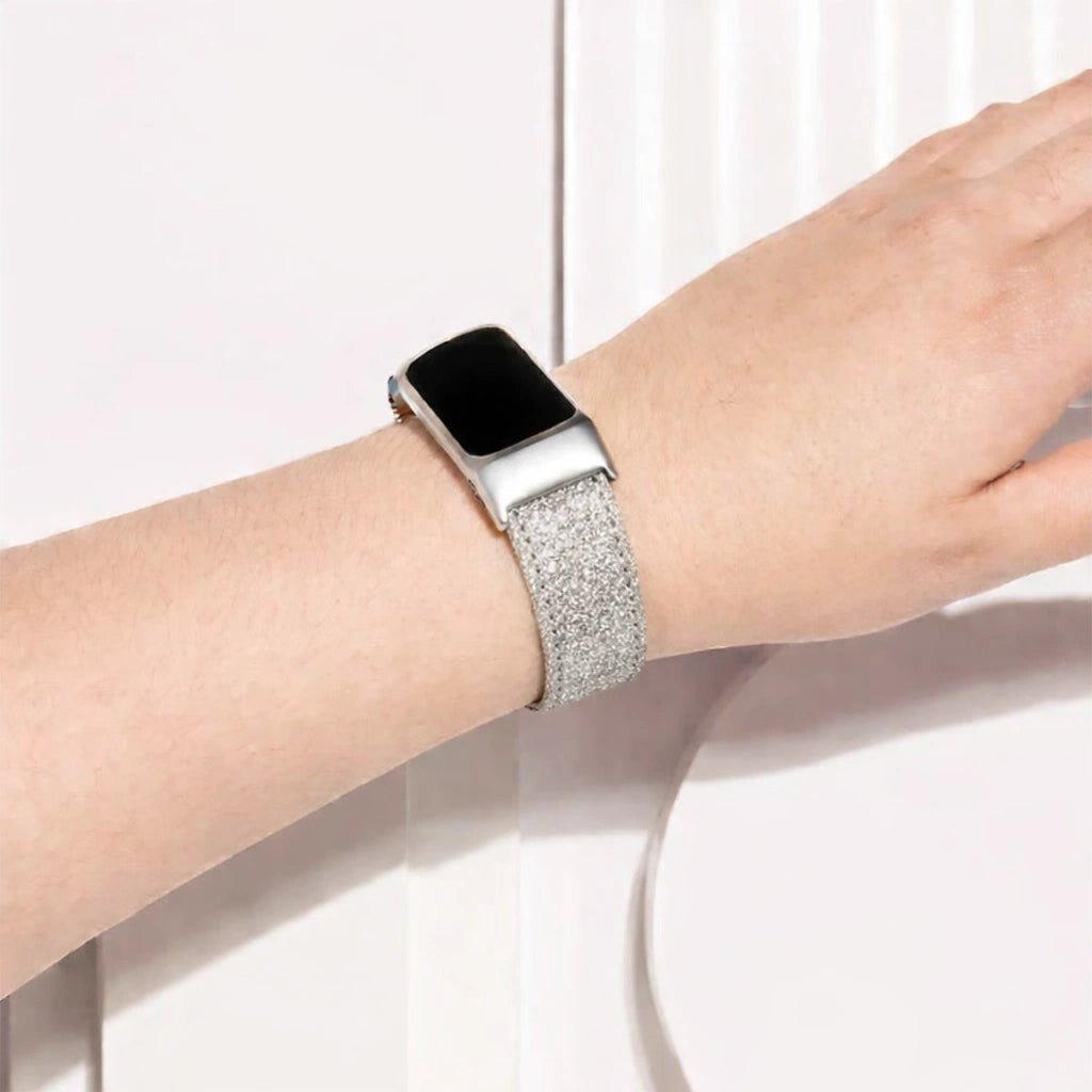 Silver shimmer leather Fitbit Charge 6 strap worn on the wrist