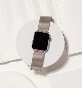 Brushed stainless steel strap designed for Apple Watch SE, in a modern silver finish.