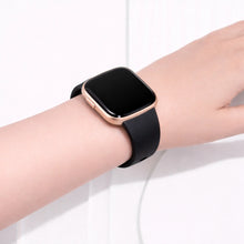 Black Fitbit Versa 2 strap worn on the wrist with smooth silicone finish