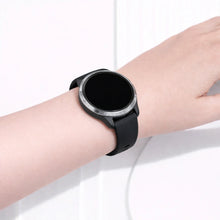 Garmin Venu fitness watch worn with a black silicone band
