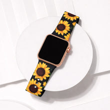 Black sunflower pattern Apple Watch strap displayed on a white platform background.