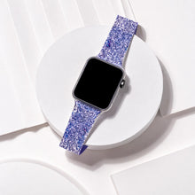 Blue glittery Apple Watch band displayed in a clean flat lay with textured sparkle