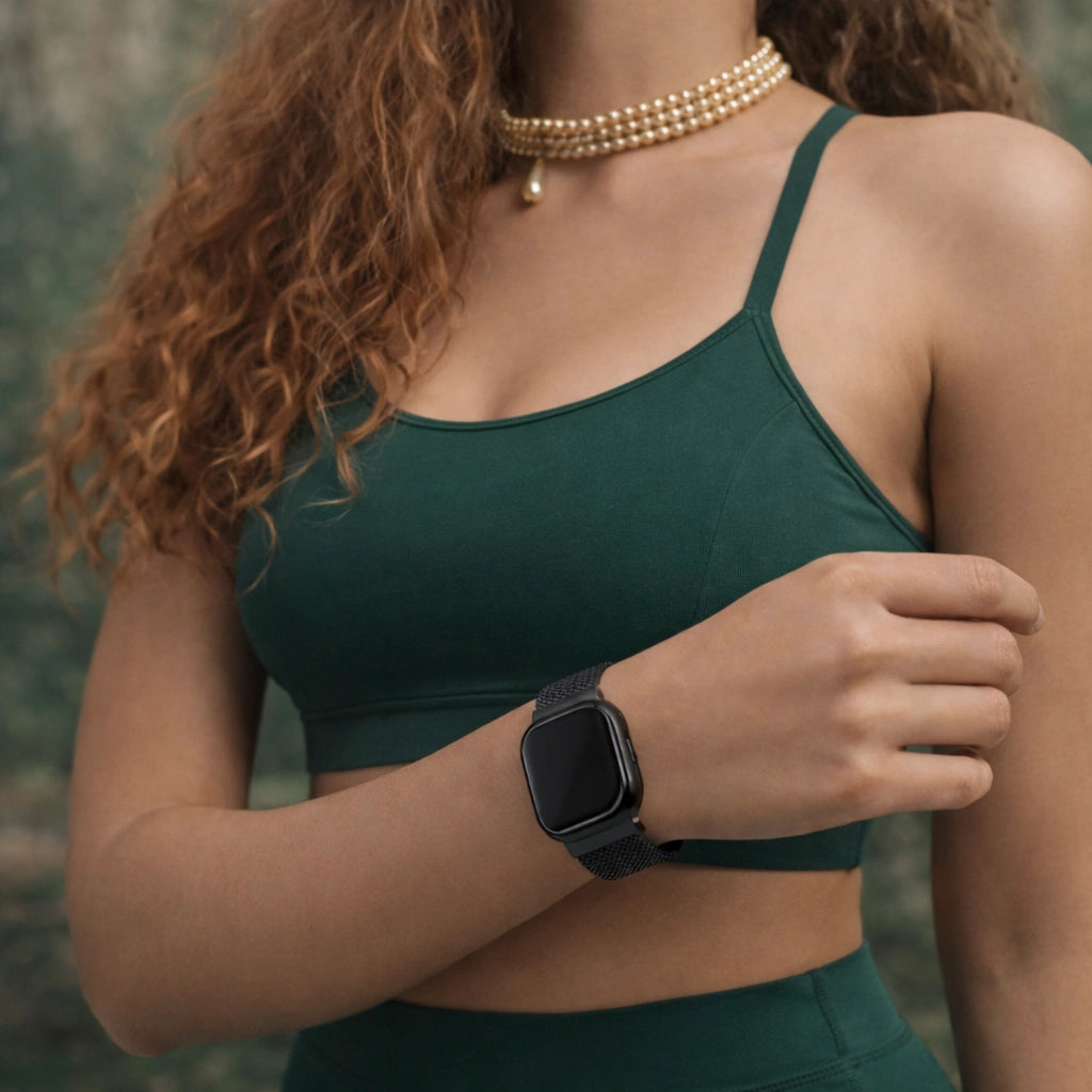 Fitbit Sense 2 black metal mesh band worn with activewear for everyday comfort