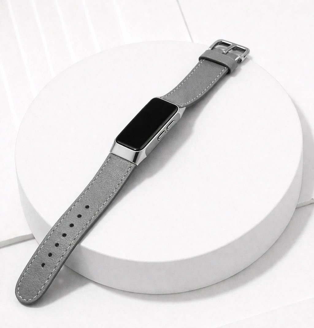 Grey leather strap for Fitbit Charge 5 shown on a clean flatlay display