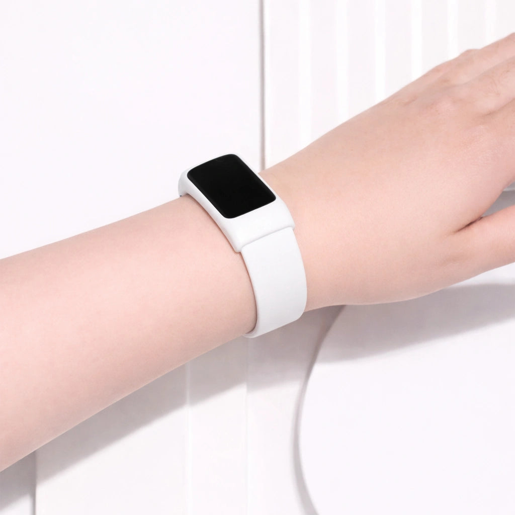 White wristband for Fitbit Charge 5 worn on wrist for a clean everyday look