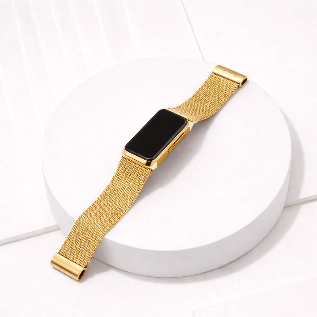 Gold metal band for Fitbit Charge 6 shown laid flat on a white background