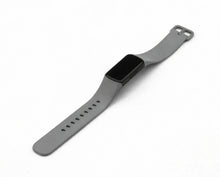 Grey silicone band designed to fit the Fitbit Charge 6 fitness tracker