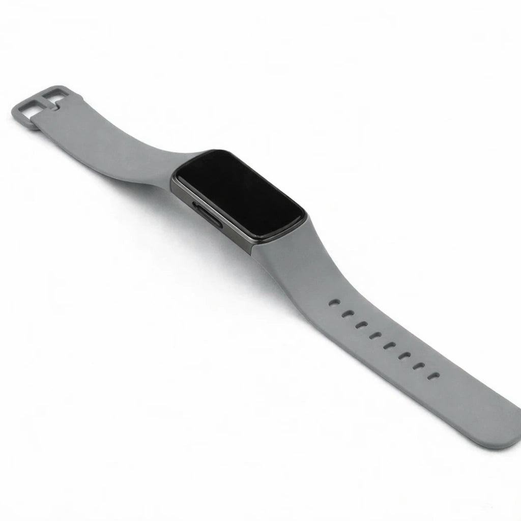 Grey silicone strap for Fitbit Charge 6 shown in a clean flat lay on a white background