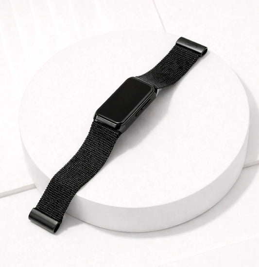 Metallic black mesh strap for Fitbit Charge 6 shown laying flat on a white surface
