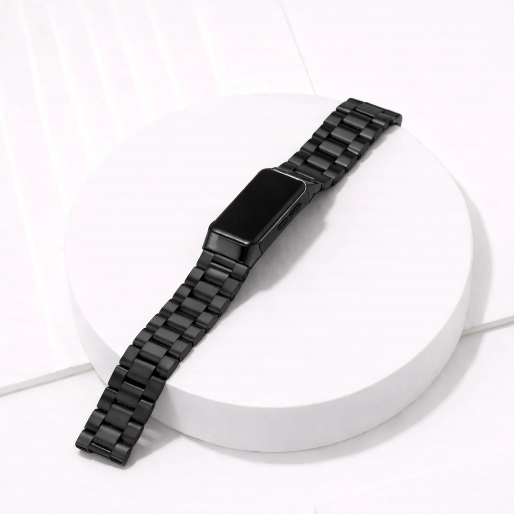 Metallic black stainless steel link strap for Fitbit Charge 6 displayed in a clean flat lay setting