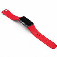 Red silicone strap for Fitbit Charge 6 shown in a flat lay studio setting