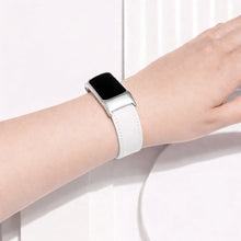 White leather strap fitted on a Fitbit Charge 6 worn on the wrist