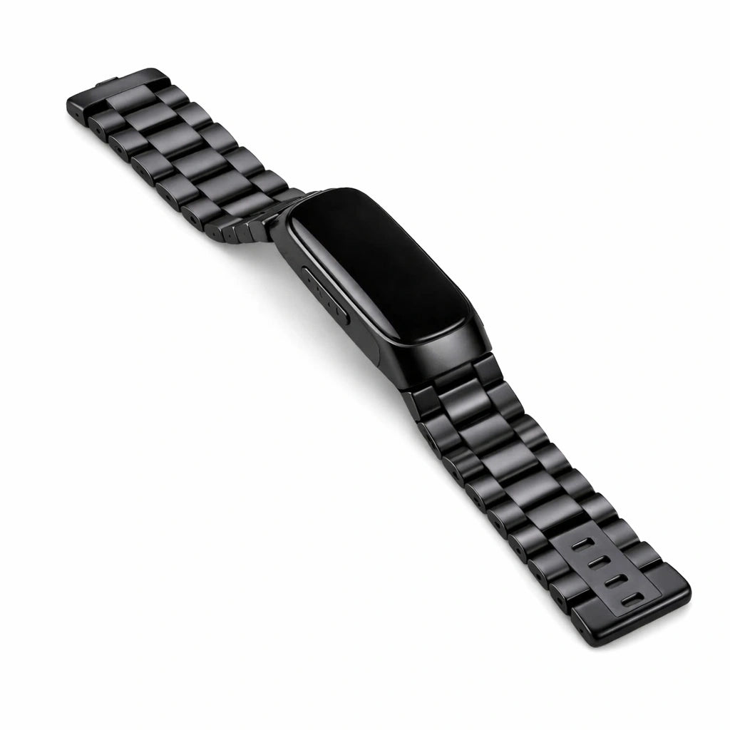 Flat lay of black stainless steel strap designed for Fitbit Inspire 2