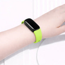 Green Fitbit Inspire 2 band worn on the wrist for a fresh, everyday look