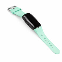 Mint watch strap for Fitbit Inspire 2 shown with tracker attached