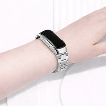 Silver metal strap on wrist for Fitbit Inspire 2, stainless steel watch band