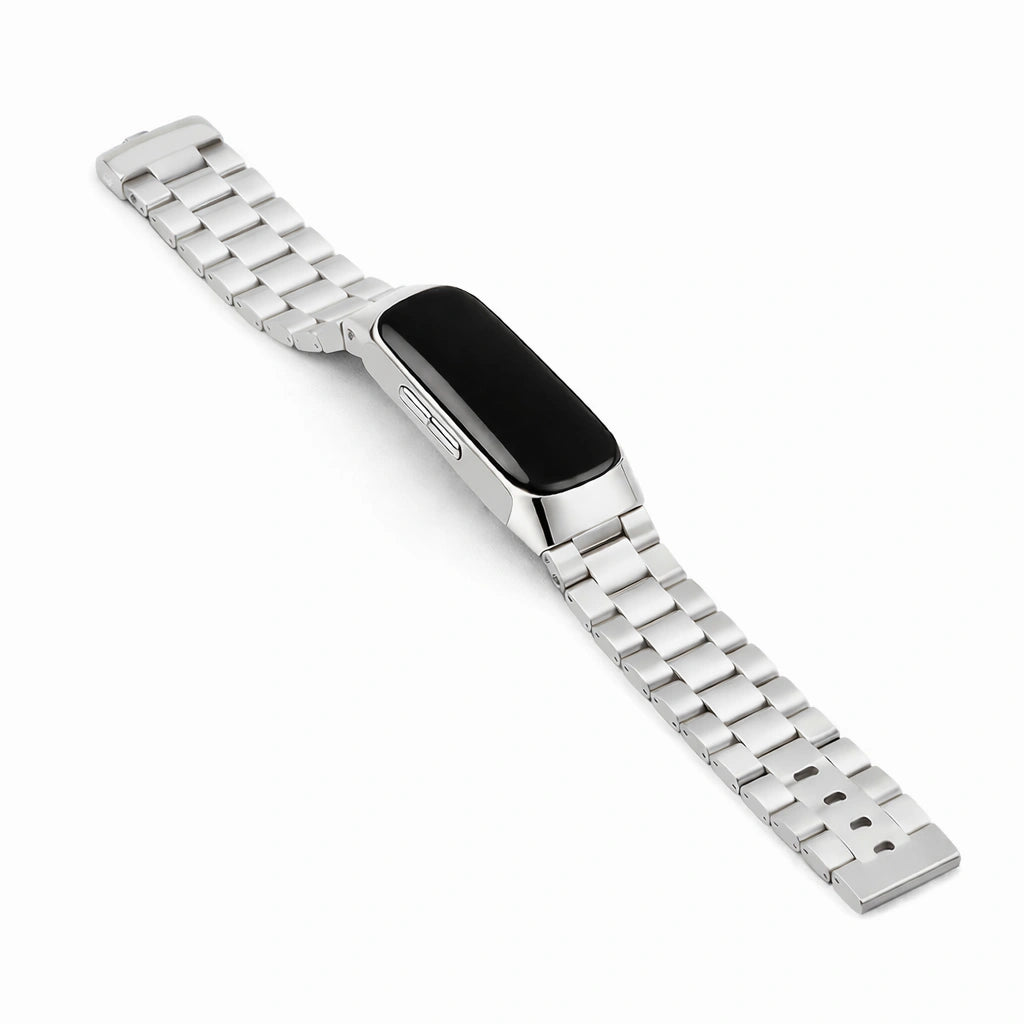 Silver stainless steel link strap for Fitbit Inspire 2 shown in flat lay