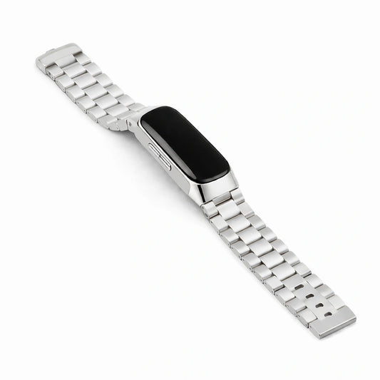 Silver stainless steel link strap for Fitbit Inspire 2 shown in flat lay