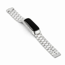 Silver stainless steel link strap for Fitbit Inspire 2 shown in flat lay