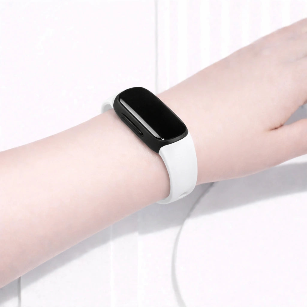White Fitbit Inspire 2 band worn on the wrist for a clean, minimalist look