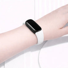 White Fitbit Inspire 2 band worn on the wrist for a clean, minimalist look