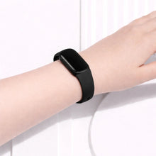 Black wristband fitted to a Fitbit Inspire 3 on the wrist