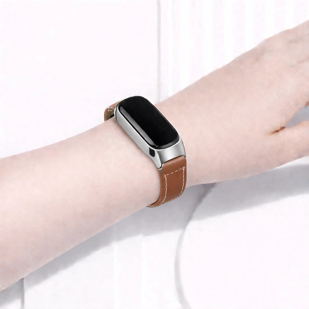 Brown watch strap worn on a Fitbit Inspire 3
