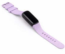 Light purple silicone watch strap for Fitbit Inspire 3 shown in a flat lay