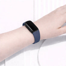 Navy wristband fitted to a Fitbit Inspire 3