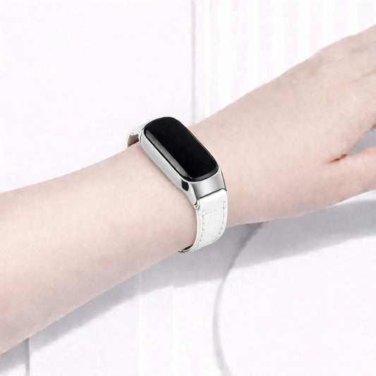 White leather wristband fitted to a Fitbit Inspire 3