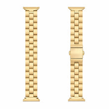 Gold stainless steel link band for Fitbit Luxe shown in flatlay with folding clasp