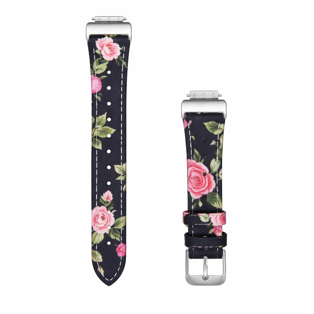Floral leather watch strap for Fitbit Luxe with pink rose pattern and silver buckle shown in flatlay