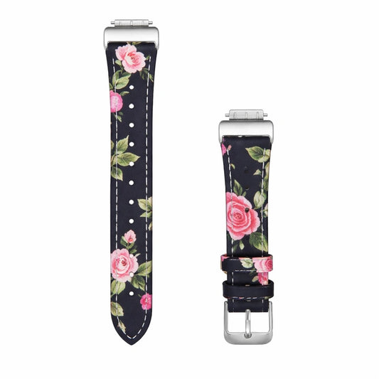Floral leather watch strap for Fitbit Luxe with pink rose pattern and silver buckle shown in flatlay