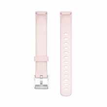 Light pink silicone watch strap compatible with Fitbit Luxe displayed on white background