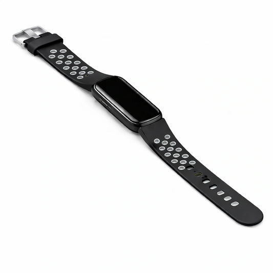 Flat lay image of a black and grey coloured sports strap for the Fitbit Luxe attached to the device. 