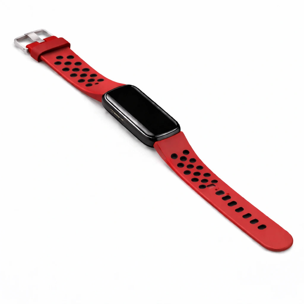 Image of a Fitbit Luxe sports style wristband with perforated holes in red-black attached to tracker