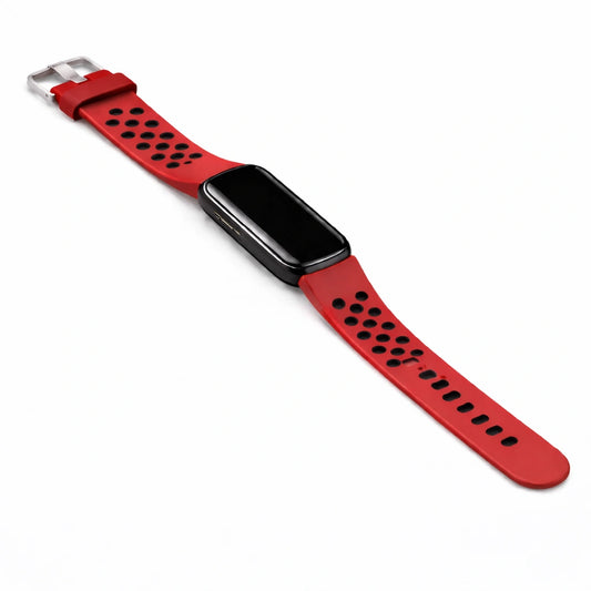 Image of a Fitbit Luxe sports style wristband with perforated holes in red-black attached to tracker