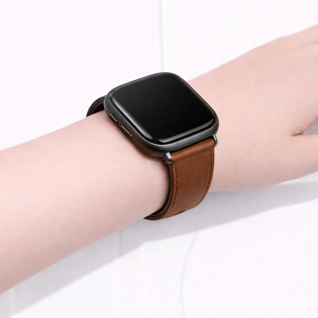 Close-up of a brown leather band on a Fitbit Versa 2, showing the slim fit and smooth leather finish.