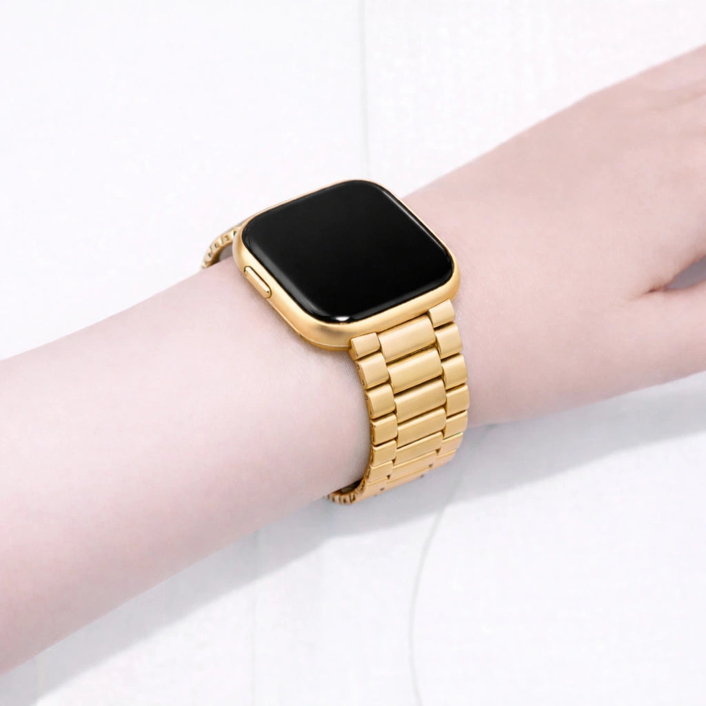 Gold metal strap on wrist fitted to a Fitbit Versa 2 smartwatch